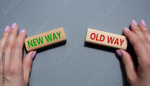 New Way or Old Way symbol. Concept word New Way or Old Way on wooden blocks. Businessman hand. Beautiful grey background. Business and New Way or Old Way concept. Copy space