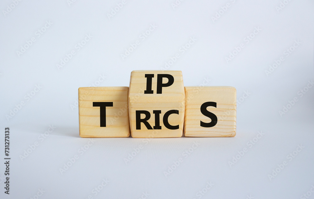 Tips and Tricks symbol. Wooden cubes with words Tricks and Tips. Beautiful white background. Business and Tips and Tricks concept. Copy space Tips and Tricks symbol. Wooden cubes with words Tricks and Tips. Beautiful white background. Business and Tips and Tricks concept. Copy space