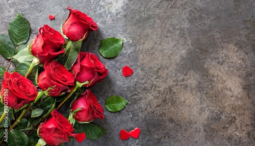 horizontal banner with bouquet of red roses on stone background valentines day greeting card © Emanuel