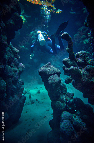Obraz na płótnie The beauty of the underwater world - a diver got lost in an underwater cave - scuba diving in the Red Sea, Egypt w salonie