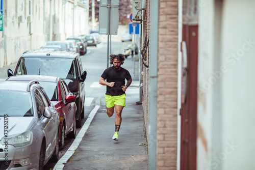 Man jogging in urban street setting