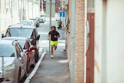 Man jogging in urban street setting