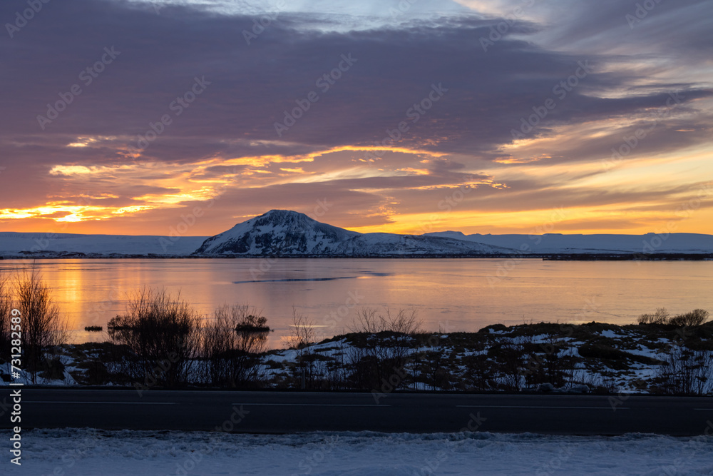 Fototapeta premium Hill and a lake during sunset, Myvatn, Iceland