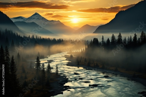 Sunrise illuminating a misty river valley flanked by mountains