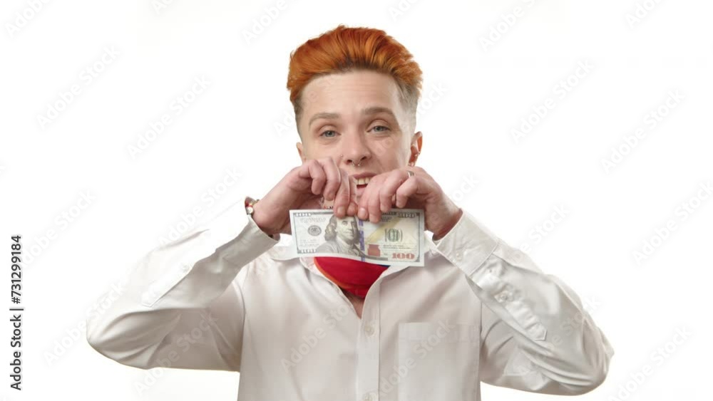 In a striking display of financial rebellion, a young lesbian woman tears up a hundred-dollar bill, challenging traditional norms of economic value and personal wealth. High quality 4k footage In a striking display of financial rebellion, a young lesbian woman tears up a hundred-dollar bill, challenging traditional norms of economic value and personal wealth. High quality 4k footage