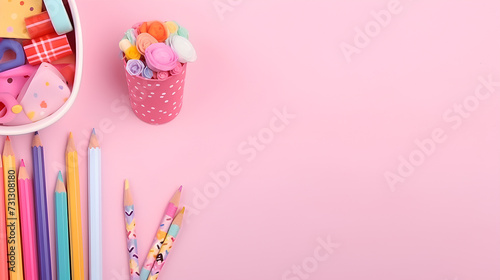 School and office supplies and stationery on pink background.