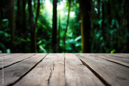 Wallpaper Mural Empty rustic wood texture of old wooden tabletop, blur on green forest background Displaying layout, mounting your product, developing key visual layout. Torontodigital.ca