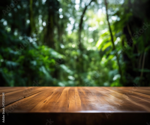 Empty rustic wood texture of old wooden tabletop  blur on green forest background Displaying layout  mounting your product  developing key visual layout.
