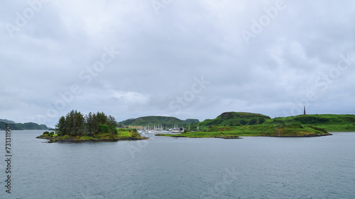 Moored boats in ocean hamlet, Inner Hebrides islands, Scotland seascape, United Kingdom, travel Europe