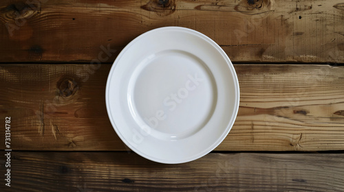 A minimalist white plate sits elegantly on a rustic wooden table, inviting culinary creativity. With a blank surface, this mockup is ideal for showcasing your mouthwatering dishes and inspir