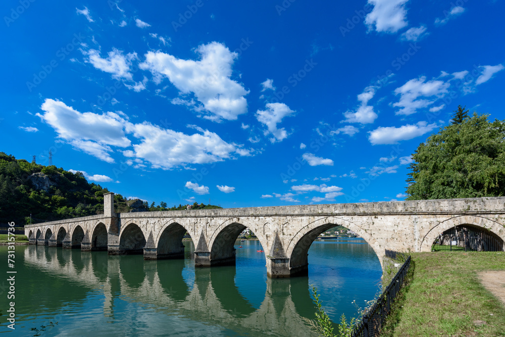 Visegrad, Bosnia and Herzegovina - August 13, 2023: Famous bridge on the Drina in Visegrad, Bosnia and Herzegovina. Mehmed Pasa Sokolovic Bridge on Drina River