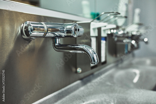 Hand wash room in the hospital. Modern preoperative room for disinfection of disinfection of doctors before surgery. Saving lives, cleanliness is the key to health, Film grain, selective focus