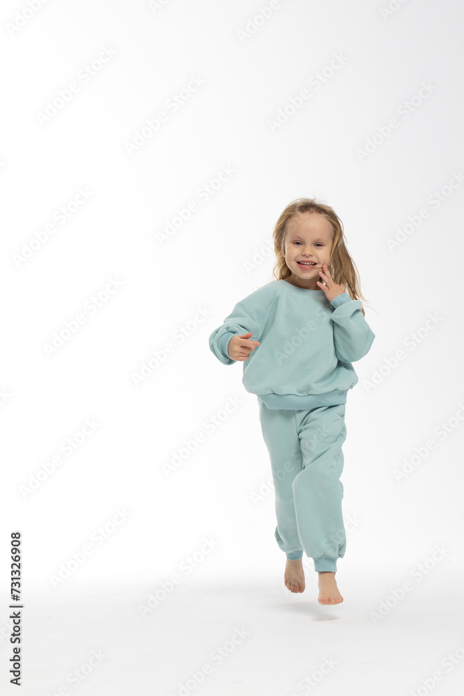 Portrait of beautiful cute little toddler girl. Child with funny face. Pretty smile kid in studio on white background. High quality photo Portrait of beautiful cute little toddler girl. Child with funny face. Pretty smile kid in studio on white background. High quality photo
