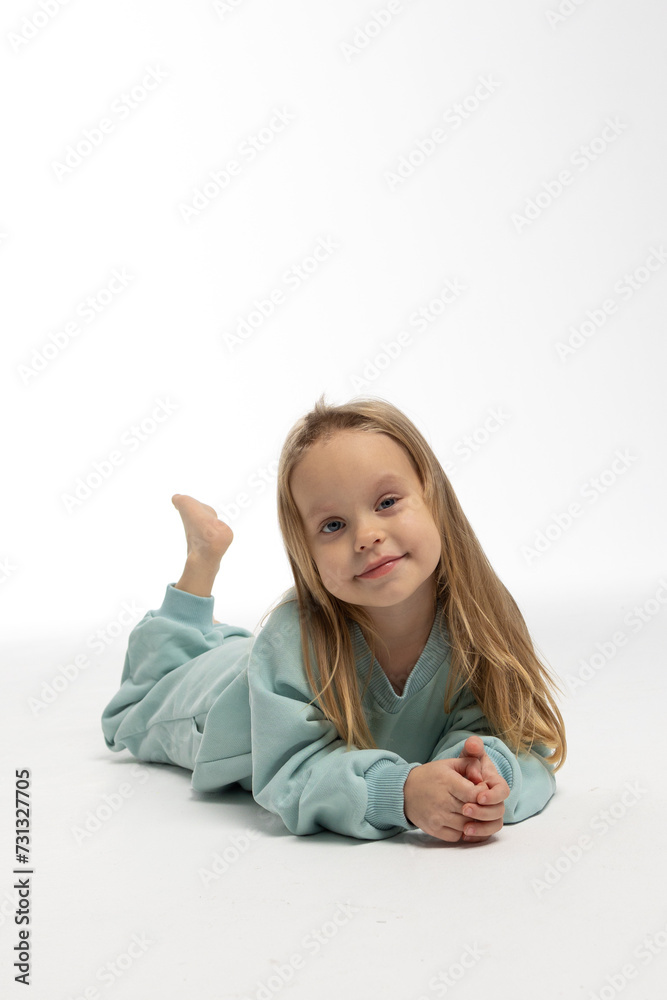 Portrait of beautiful cute little toddler girl. Child with funny face. Pretty smile kid in studio on white background. High quality photo Portrait of beautiful cute little toddler girl. Child with funny face. Pretty smile kid in studio on white background. High quality photo