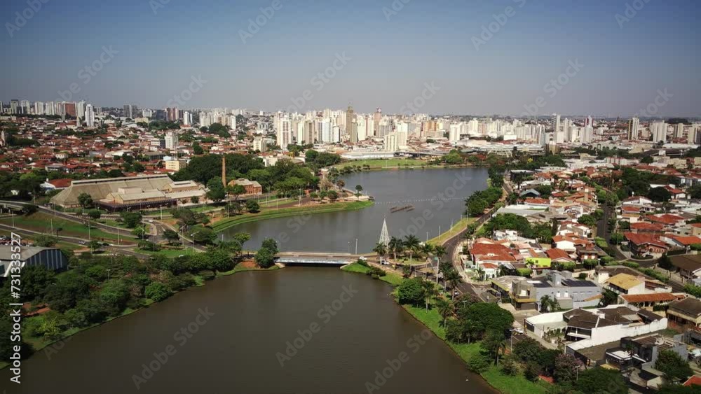 Drone Video of Municipal Reservoir in São José do Rio Preto, Brazil, with Cityscape in the Background on a Sunny Day Drone Video of Municipal Reservoir in São José do Rio Preto, Brazil, with Cityscape in the Background on a Sunny Day