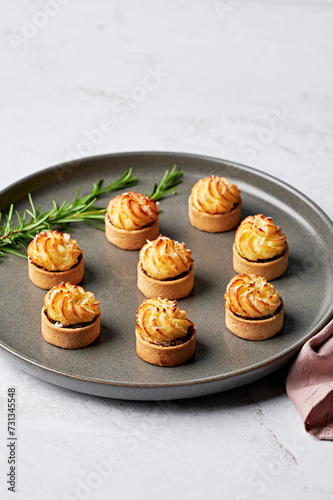 Mini lamb, pea & rosemary shepherds pie, parmesan & garlic duchess potato