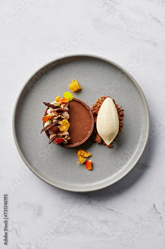 Chocolate & spiced pumpkin tart, buttered pecans, salted chocolate crumb, beurre noisette ice cream photo