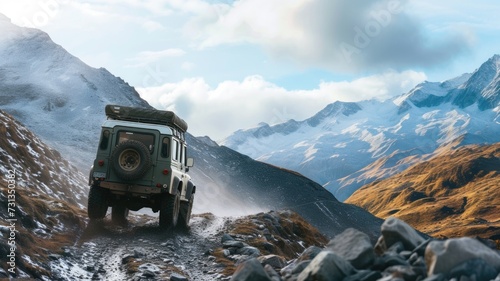 Off-road vehicle on a rocky mountain path at sunset, highlighting adventure and rugged terrain