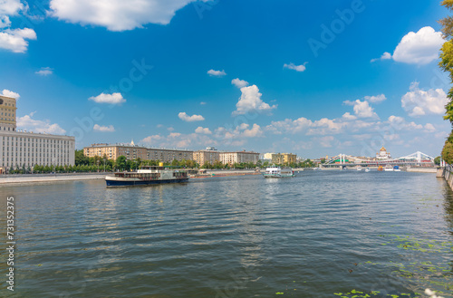 Fototapeta Naklejka Na Ścianę i Meble -  Cruise ship sails on the Moscow river in Moscow city center, popular place for walking.