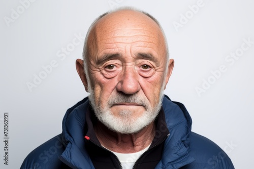 Portrait of an old man with a surprised expression on his face