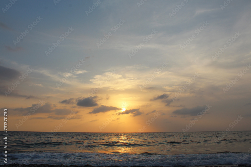 natural background of evening cloudy at sunset over the ocean