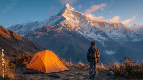 Camping tent of a hiker at beautiful Himalaya area while travel on his trip in the misty morning sunrise.