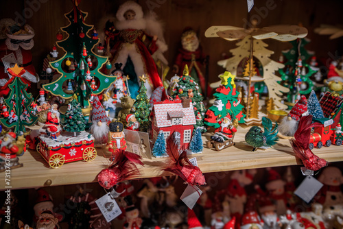 Display full of colorful Christmas ornaments and toys for sale at a souvenir shop in the old town in Strasbourg  France