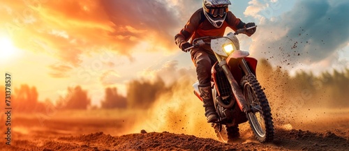 A fearless rider conquers the rugged terrain, soaring through the sky on their dirt bike, leaving a trail of dust and tire tracks behind them as the sun sets on their daring motorcycle adventure