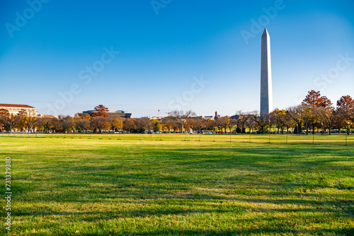 The Washington Monument in Washington, DC on an autumn day against a blue sky.