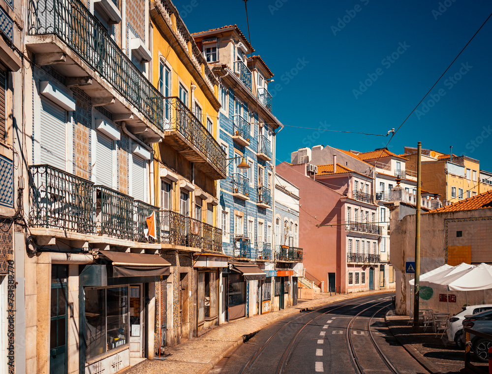 Street view with old traditional architecture and a tramway in downtown Lisbon, Portugal