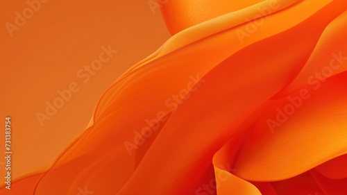 Abstract close-up of vibrant orange waves of flowing satin fabric photo