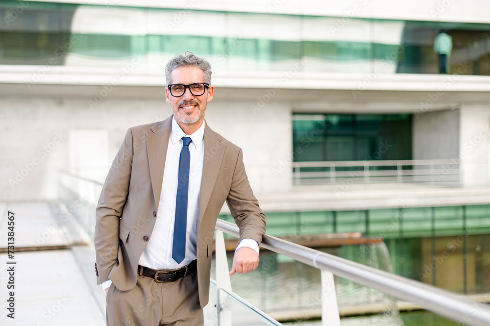 The seasoned businessman leans casually against a railing, his posture relaxed yet confident, with a modern building forming the backdrop. A blend of casual professionalism and accessibility The seasoned businessman leans casually against a railing, his posture relaxed yet confident, with a modern building forming the backdrop. A blend of casual professionalism and accessibility