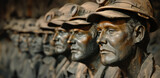 a row of worn bronze statues of skilled workers and trades people