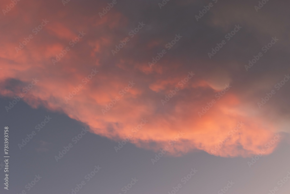 Orange Sunset background with different textures and colors in the clouds.
