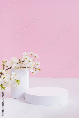 Empty podium or pedestal with spring bloom. Mock up for cosmetic products