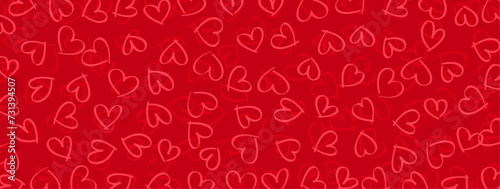 doodle-style pattern of hearts in saturated and darker shade of red against a deep red background
