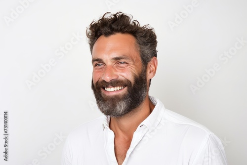 Handsome man with long beard and mustache on white background.