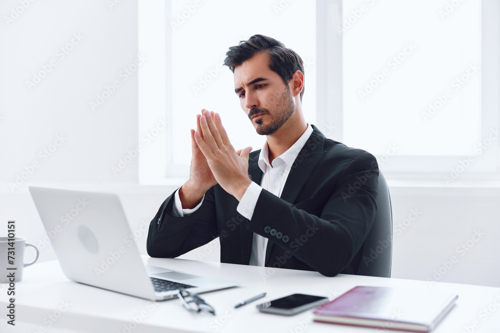 Man in office businessman sitting at desk and working in laptop, finance and startup concept, working lifestyle in bright office. Man in office businessman sitting at desk and working in laptop, finance and startup concept, working lifestyle in bright office.