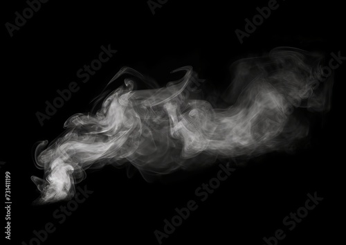 smoke floating in the air on a black background