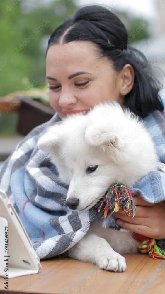 Happy woman with a smiling dog breed companion, a German Spitz Mittel Happy woman with a smiling dog breed companion, a German Spitz Mittel