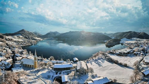 Lake Schliersee in Bavaria. Cinemagraph seamless loop time lapse. Winter landscape, white snow, alps mountains. photo