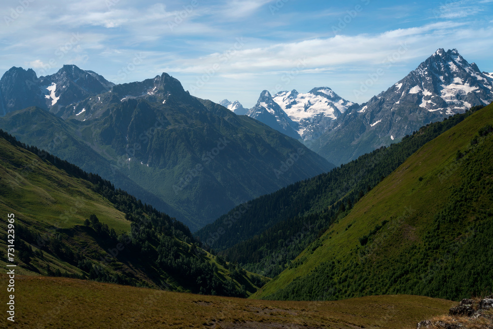 Obraz premium View of the peaks of the North Caucasus mountains near the Arkhyz ski resort on a sunny summer day, Karachay-Cherkessia, Russia