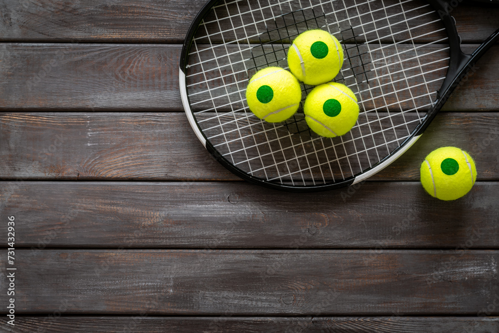 Tennis racquet and balls, top view. Sport games background