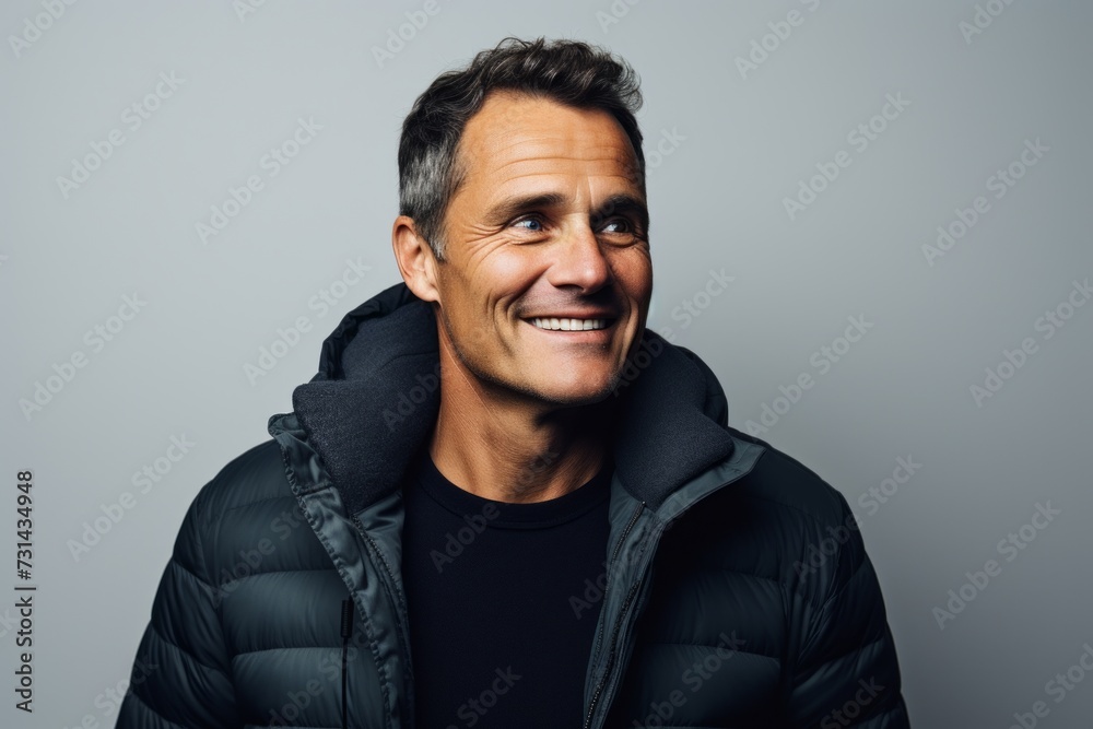 Portrait of a smiling middle-aged man in a black jacket. Portrait of a smiling middle-aged man in a black jacket.