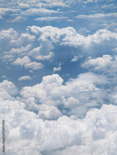 A breathtaking view of fluffy, white clouds scattered across the sky.