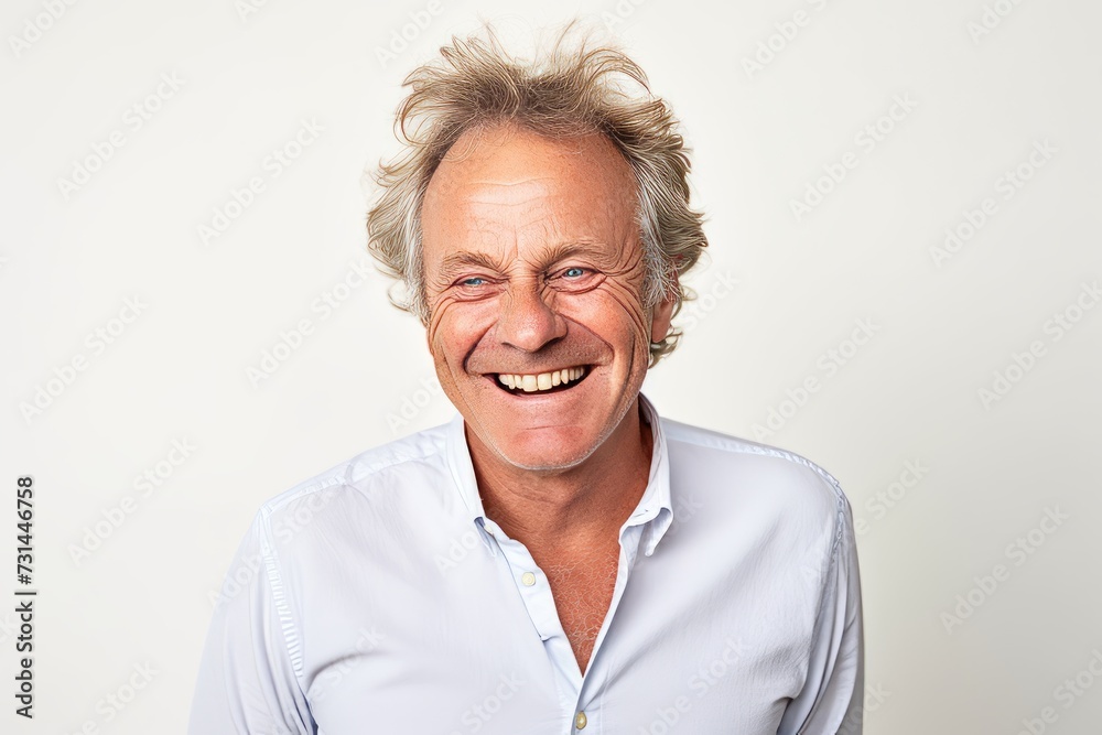 Portrait of a happy senior man smiling on a white background. Portrait of a happy senior man smiling on a white background.