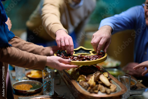 In this modern portrayal, a European Islamic family partakes in the tradition of breaking their Ramadan fast with dates, symbolizing unity, cultural heritage, and spiritual observance during the holy photo