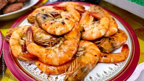 Grilled shrimp with sauce on a plate