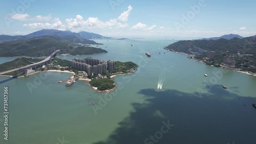 Sham Tseng Ting Kau Tsing Lung Tau Castle Peak Road and Tuen Mun Road Highway Flyover Traffic Roads are built along the slopes of the curved coastline with embankments bridges and culverts  photo