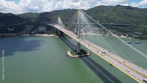 Ting Kau Bridge is the world's first three-tower cable-stayed bridge connecting Tuen Mun Tsuen Wan Sham Tseng and Tsing Yi, a three-lane dual-divided expressway traffic highway flyover infrastructure  photo